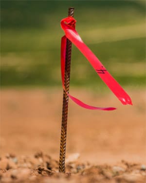 land-survey-stakes-property-law-dispute-ogden-law Property Law Attorney Chink Ogden assists Northshore clients with property line disputes