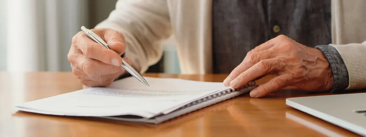 Person reviewing estate planning documents in Covington Louisiana with Ogden Law